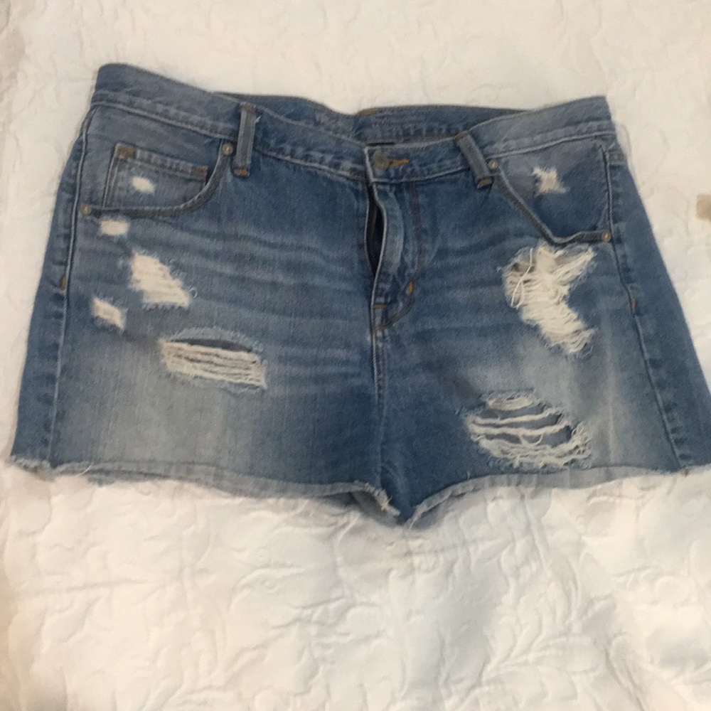 Distressed denim shorts.